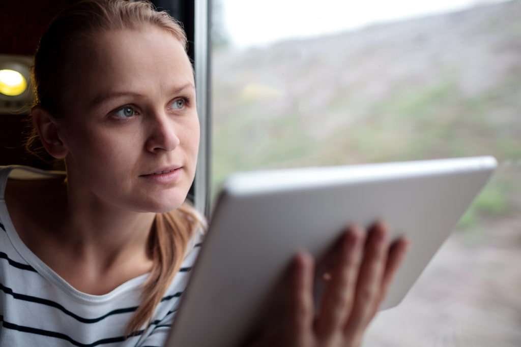 woman traveling for business using VoIP